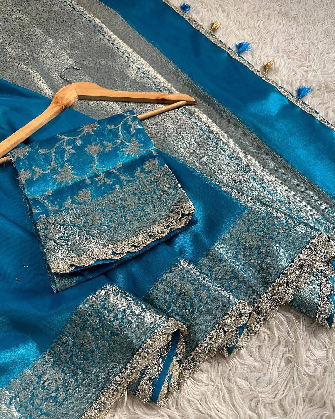 A Designer Banarasi Maharani Tissue Silk Saree with handwork lace border for weddings