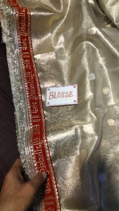 A Banarasi Premium “Sada saubhagyawati” tissue silk white-red border kadhwa saree