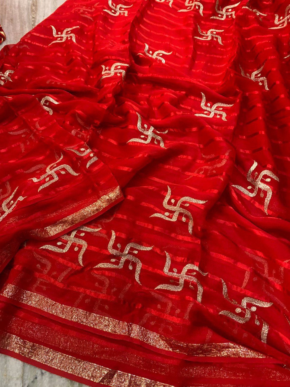 A Beautiful Swastik Design Pure Viscose Georgette Saree